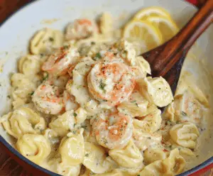 Creamy shrimp and tortellini pasta dish topped with lemon and garlic in a luscious lemon garlic cream sauce