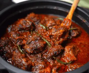 Delicious homemade Nigerian beef stew with tender beef, rich tomato sauce, and flavorful spices, perfect for serving with rice or bread.