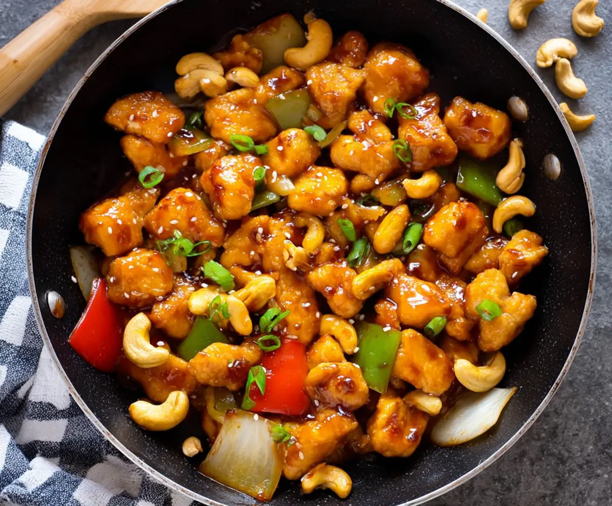 Delicious homemade Cashew Chicken with crispy vegetables and savory sauce, easy to prepare at home.