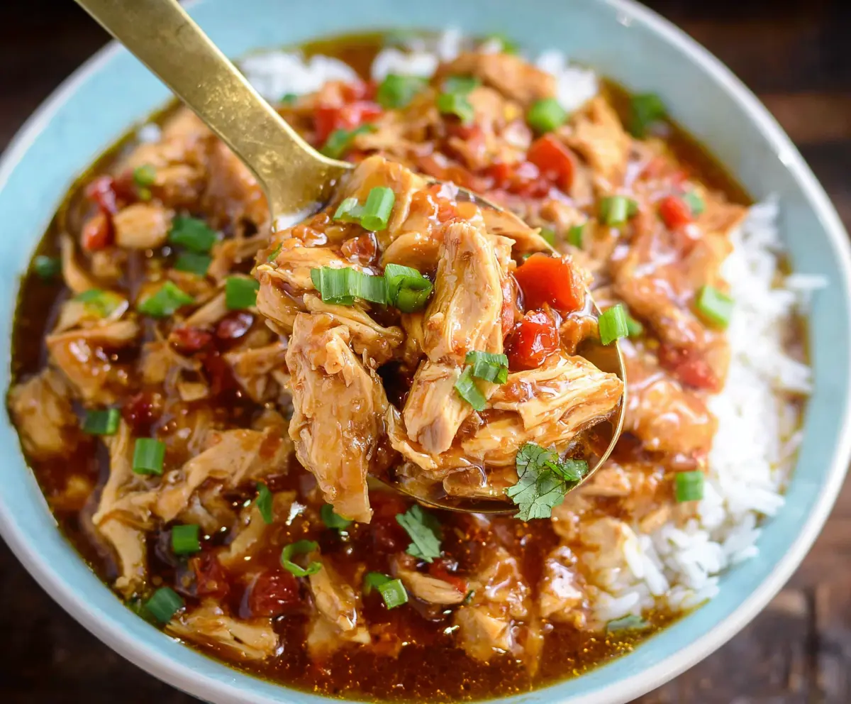 Delicious slow cooker sweet chili chicken served with vegetables and rice.