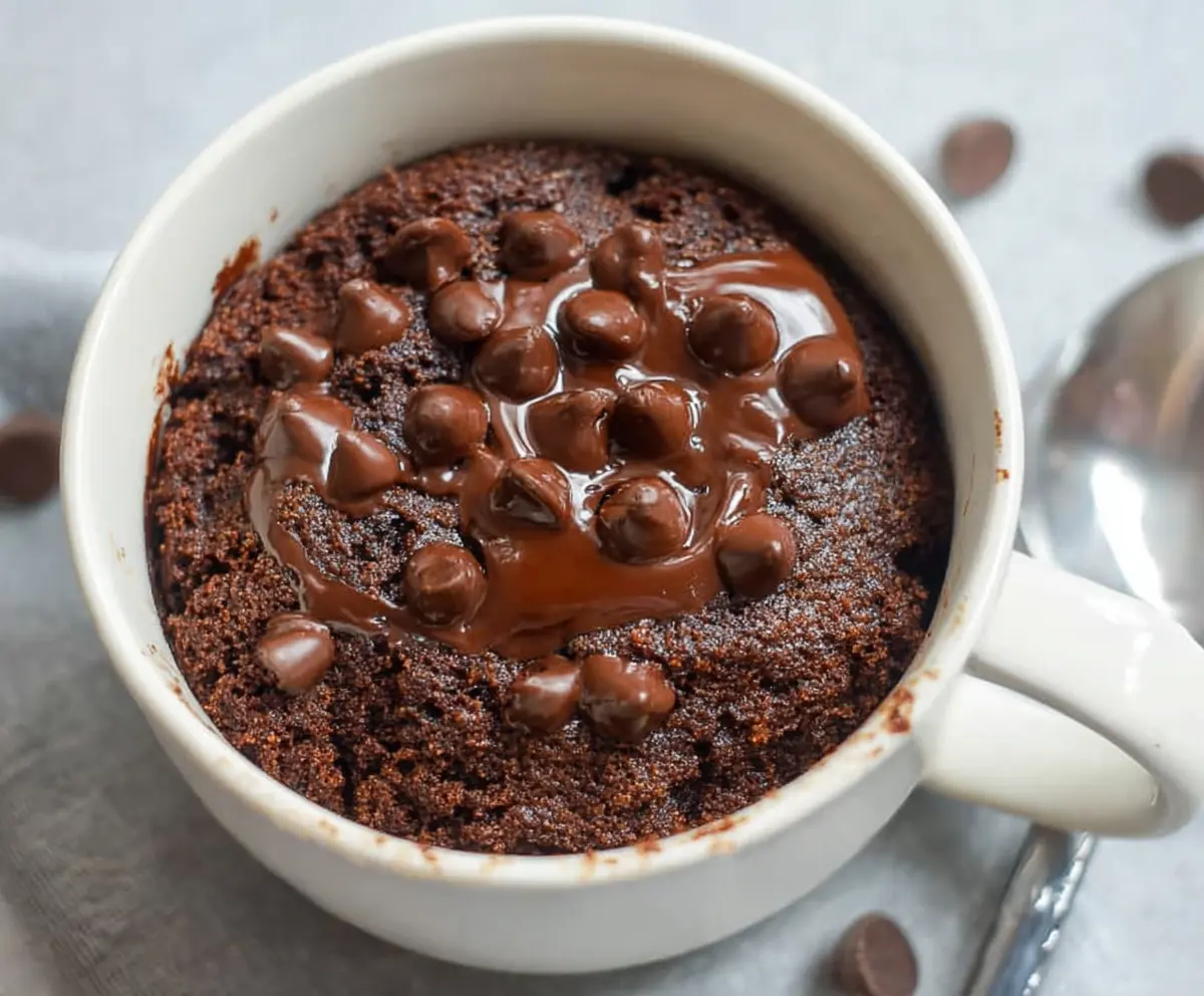 Delicious healthy chocolate mug cake in a mug, perfect for quick desserts and guilt-free indulgence.